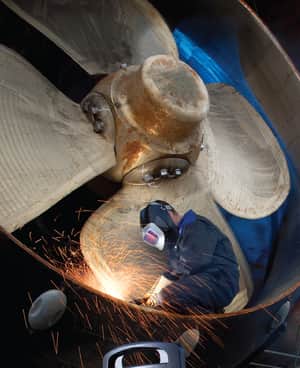 cutting metal on ship propeller