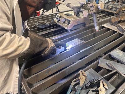 Image of cutting metal on a cutting table