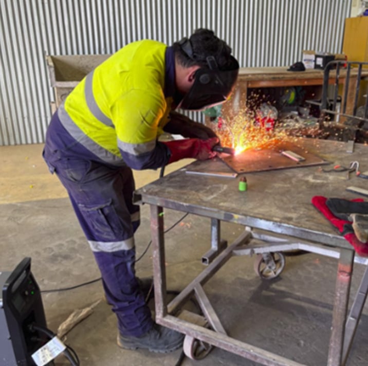 Image of workers flush cutting