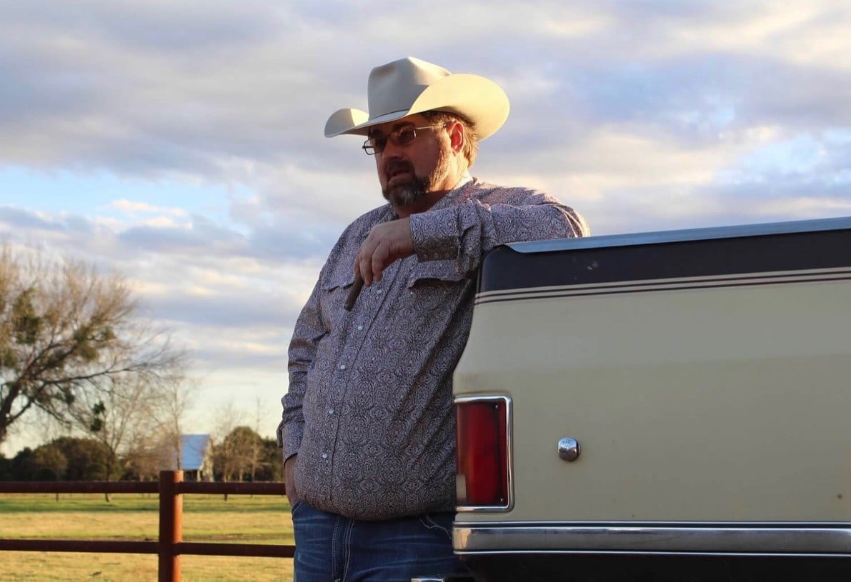Jimmy Don Holmes with his truck.jpg