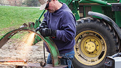 Air plasma cutter in use - farm tractor repair